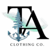 Tamarack Atlantic Clothing Co. official logo, 300x300px, transparent. A tamarack tree that is rooted in a ship anchor. Mountain peak elements can be seen behind the anchor. Large, majestic letters "TA" tower over the tamarack tree as northern lights whisp across the logo.