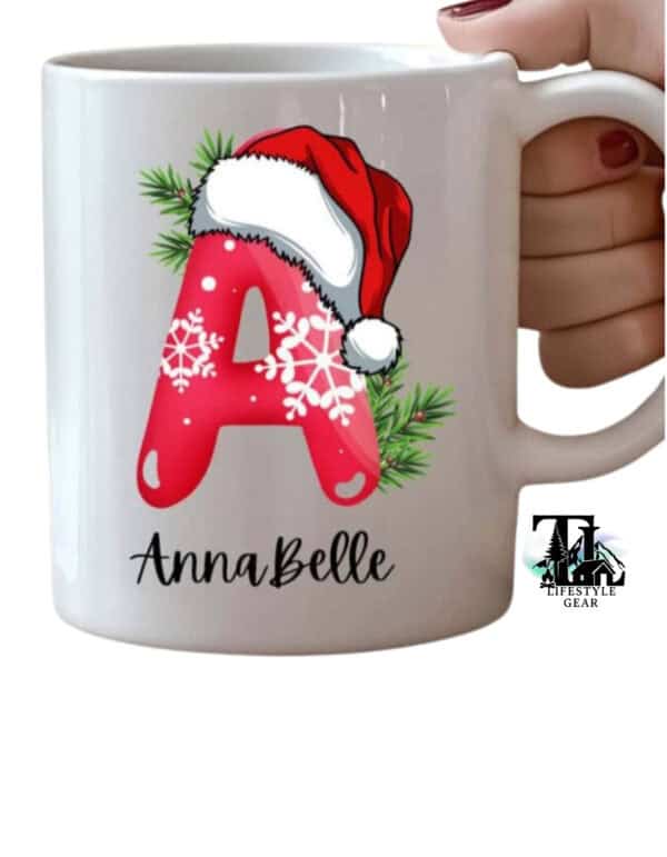 White 12 oz ceramic kids mug with christmas initial customized. Letter A with Santa Hat and snowflake pattern bubble font. Christmas aesthetic