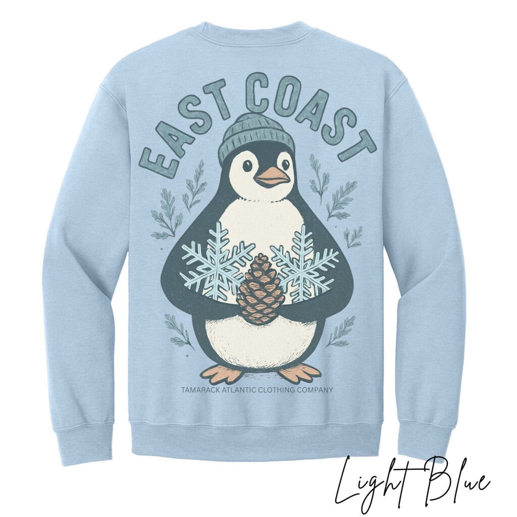 2025/09/1000161618-scaled.jpg Snowy Penguin Comfort Sweatshirt - Image 1