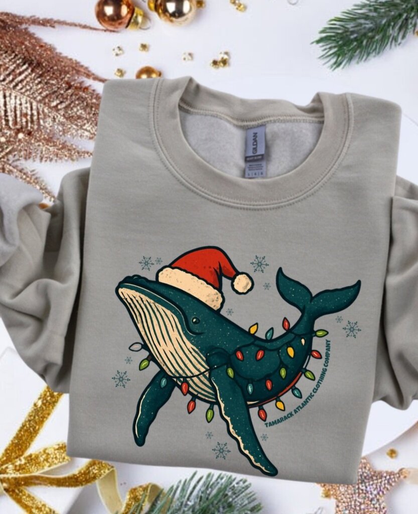 2025/10/1000121189.jpg Tamarack Atlantic Clothing Sweatshirt humpback whale christmas lights in sandstone color.