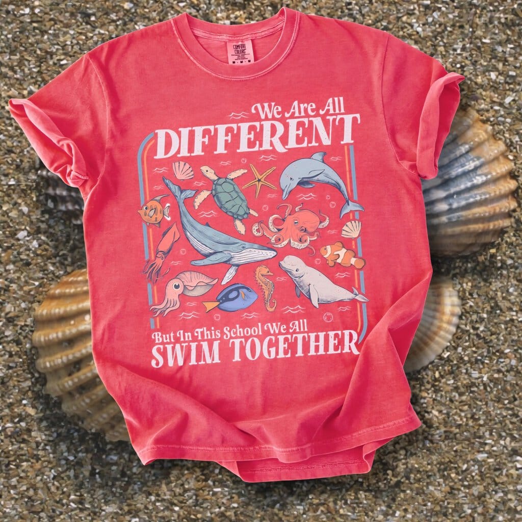 2026/01/1000128975-scaled.jpg We Swim Together Comfort Tee - Image 1